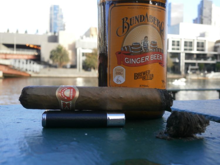 H. Upmann Tacos Imperiales Réplica de Humidor Antiguo 2006, partially smoked, with a bottle of Bundaberg Ginger Beer